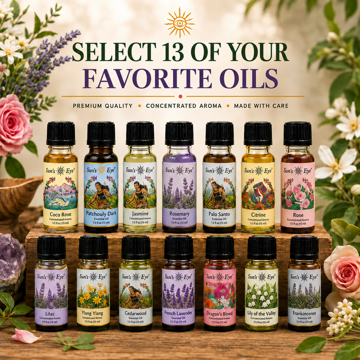 A promotional display of 13 small essential oil bottles from Sun's Eye arranged on a wooden stand, with large text reading 'SELECT 13 OF YOUR FAVORITE OILS' and floral decorations around the bottles.