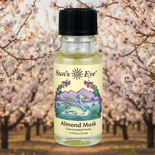 Bottle of Sun's Eye Almond Musk aroma with cherry blossom trees in the background Sun's Eye Scentsium