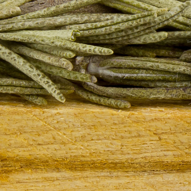 Close-up of rosemary on a wooden surface Sun's Eye Scentsium