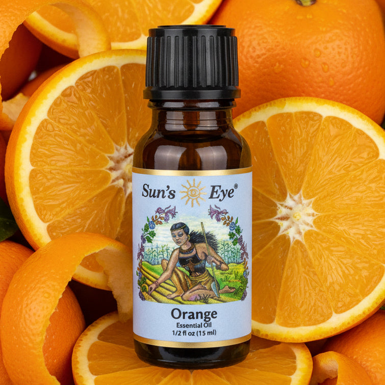 Sun's Eye Orange Essential Oil bottle on a orange background