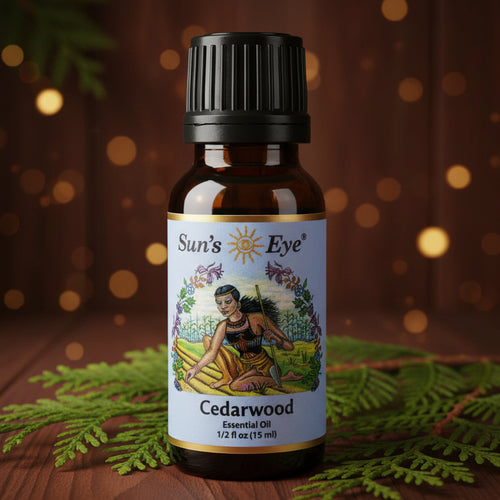 Sun's Eye Orange Essential Oil bottle on a light gray background