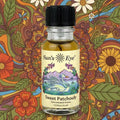 Bottle of Sun's Eye Sweet Patchouly with a colorful floral and nature-themed background Sun's Eye Scentsium Sun's Eye Scentsium