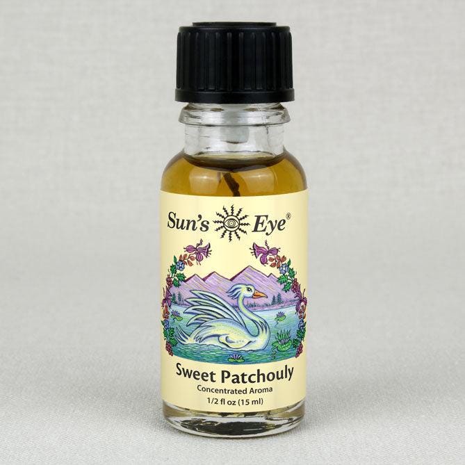 Bottle of Sun's Eye Sweet Patchouli aroma on a gray background