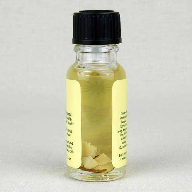 Small glass bottle with a black cap and yellow label on a light gray background