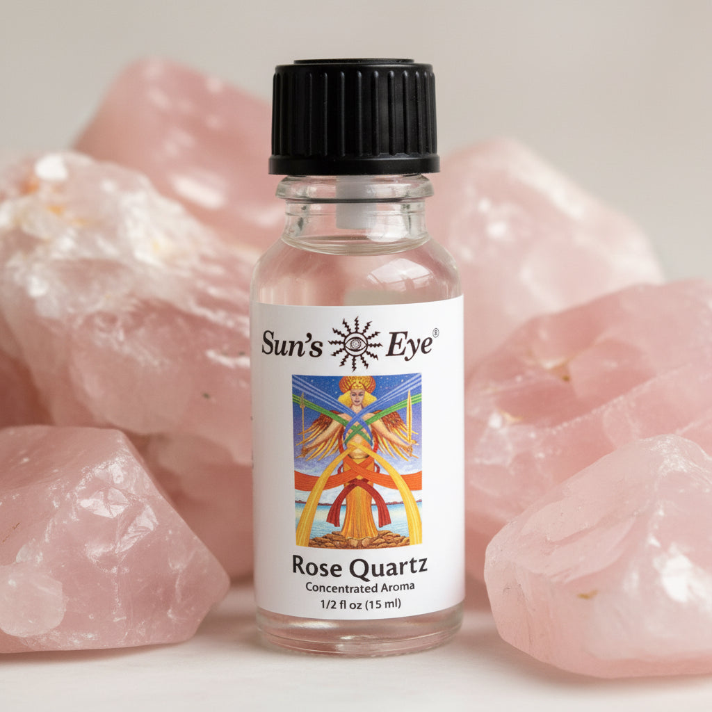 Bottle of Sun's Eye Rose Quartz concentrated aroma on a rose quartz background