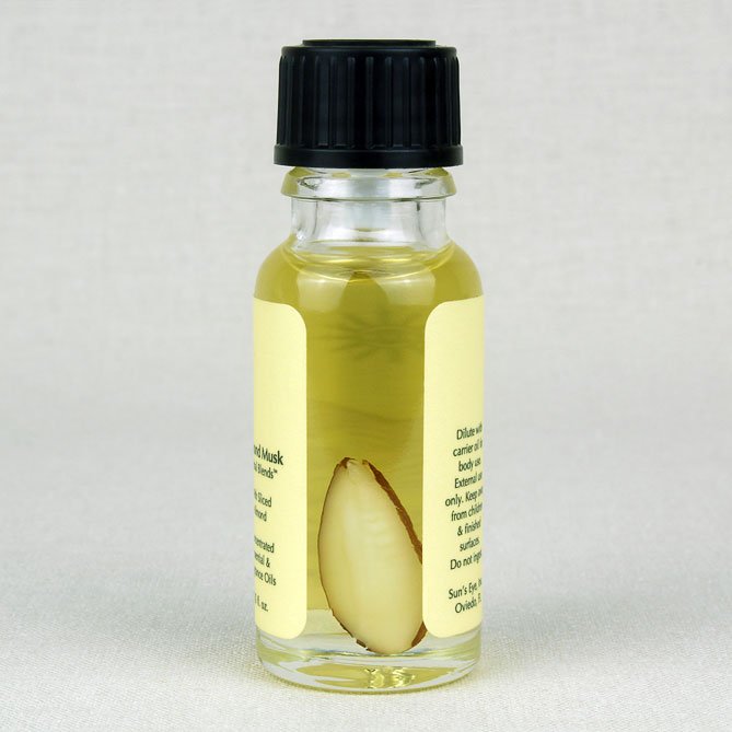 Small glass bottle with a black cap and yellow label on a light gray background