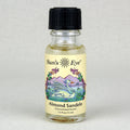 Bottle of Sun's Eye Almond Sandelwood aroma on a light gray background
