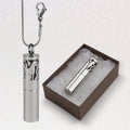 Silver cylindrical urn with cat design on a white background