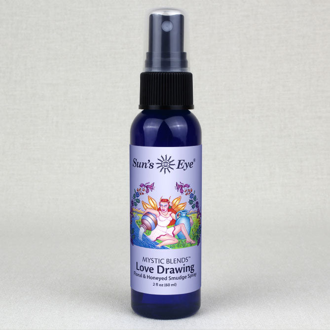 Blue spray bottle labeled 'Sun's Eye Mystic Blends Love Drawing' on a light gray background