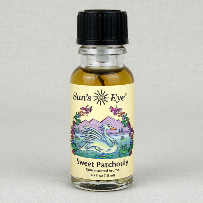 Bottle of Sun's Eye Sweet Patchouli aroma on a gray background