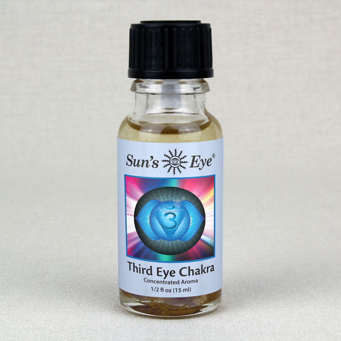 Bottle of Sun's Eye Third Eye Chakra concentrate aroma on a light gray background